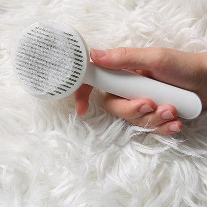 Brush with self-cleaning button for animal fur 